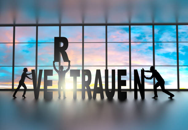 istock Team building the word  vertrauen (trust in german) 972328640