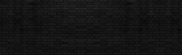 istock Panorama of Black stone brick texture and background 972339560