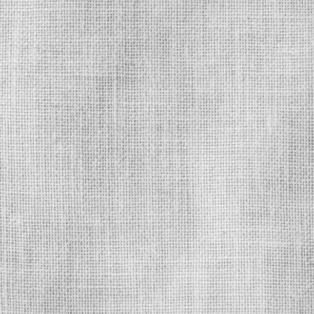 istock Hessian sackcloth woven texture background in light white gray 972347062