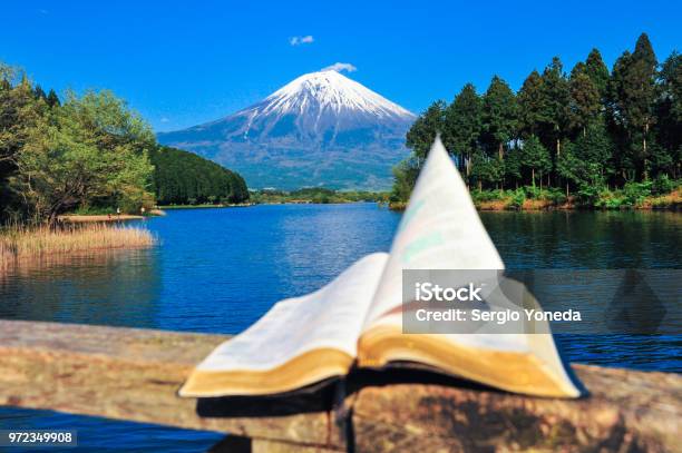 Bible Open In Front Of The Majestic Mount Fuji Stock Photo - Download Image Now - Bible, God, Scenics - Nature
