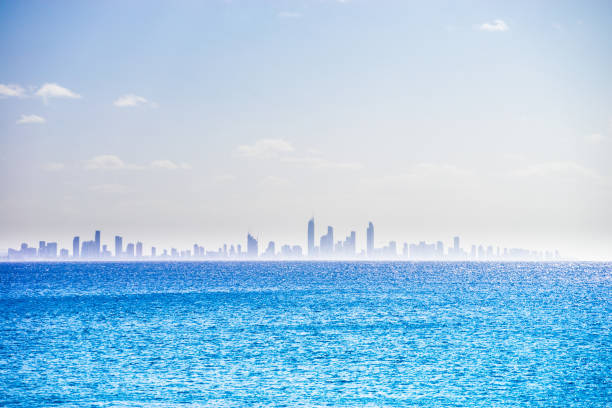 A silhouette of the Gold Coast skyline overlooking the water with copy space