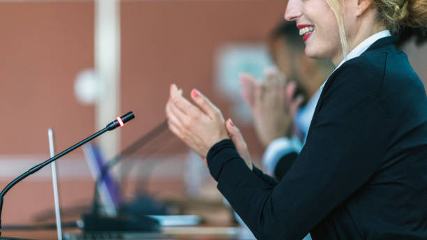 istock Female committee member applauding 972369846