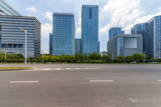 istock Panoramic skyline and modern business office buildings with empty road,empty concrete square floor 972371948