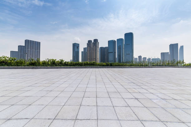 istock Panoramic skyline and modern business office buildings with empty road,empty concrete square floor 972372192