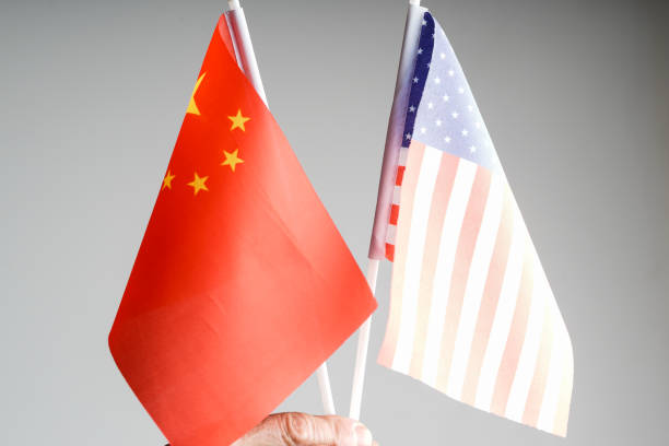 istock China amd USA flag with grey background studio shot 972372306