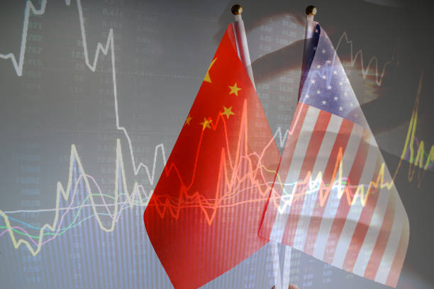 istock China amd USA flag with grey background studio shot 972372364