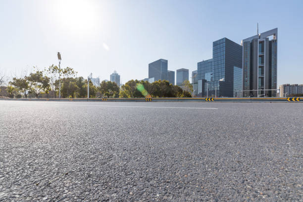 istock Panoramic skyline and modern business office buildings with empty road,empty concrete square floor 972374450