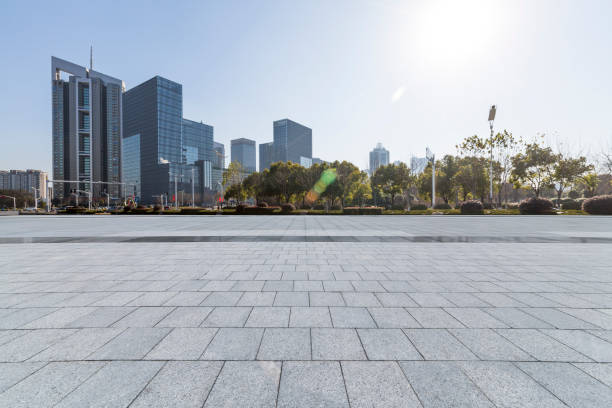 istock Panoramic skyline and modern business office buildings with empty road,empty concrete square floor 972374478