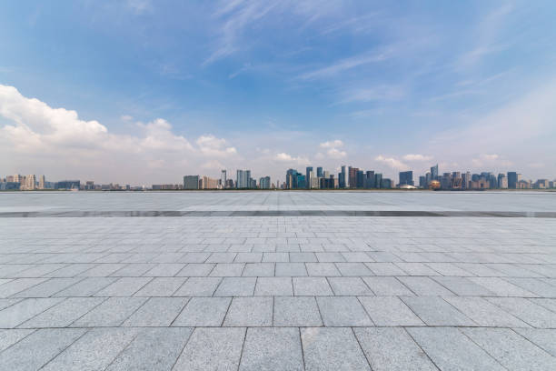 istock Panoramic skyline and modern business office buildings with empty road,empty concrete square floor 972374776