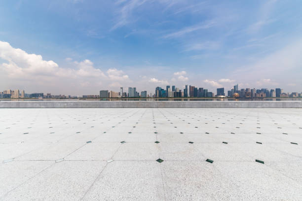 istock Panoramic skyline and modern business office buildings with empty road,empty concrete square floor 972374812