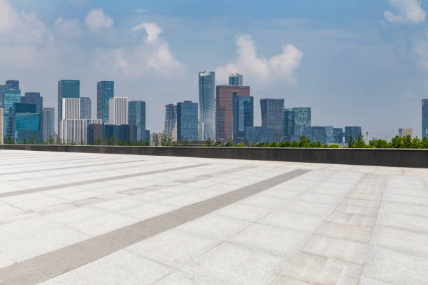 istock Panoramic skyline and modern business office buildings with empty road,empty concrete square floor 972374848