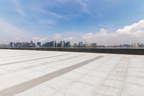 istock Panoramic skyline and modern business office buildings with empty road,empty concrete square floor 972374904