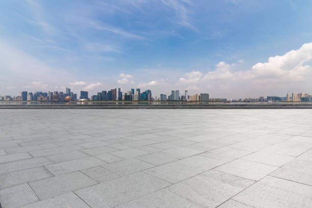 istock Panoramic skyline and modern business office buildings with empty road,empty concrete square floor 972376970