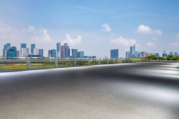 istock Panoramic skyline and modern business office buildings with empty road,empty concrete square floor 972376976