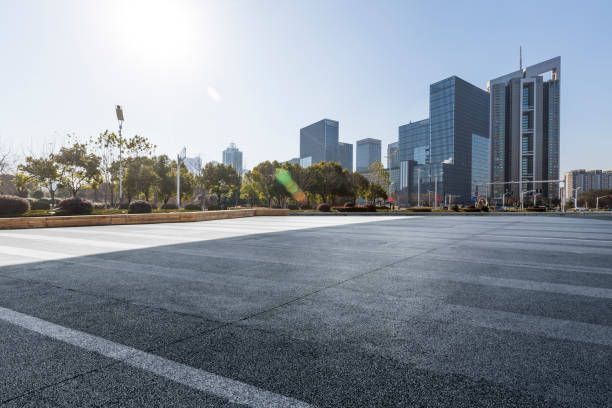 istock Panoramic skyline and modern business office buildings with empty road,empty concrete square floor 972377000