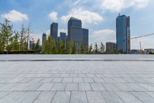 istock Panoramic skyline and modern business office buildings with empty road,empty concrete square floor 972377096