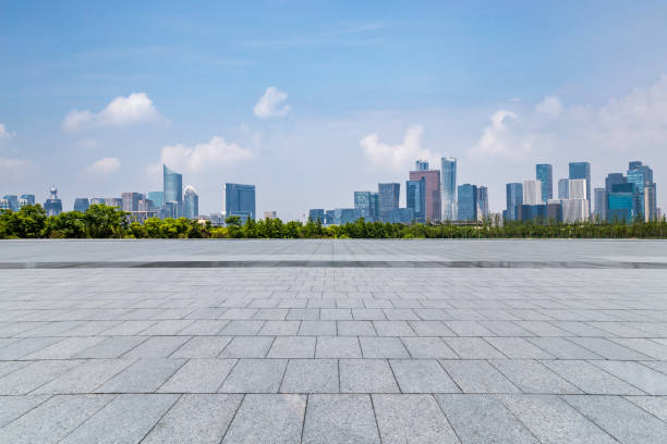 istock Panoramic skyline and modern business office buildings with empty road,empty concrete square floor 972377120