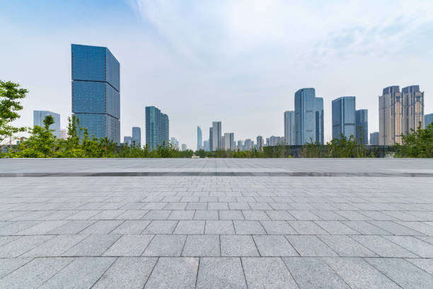 istock Panoramic skyline and modern business office buildings with empty road,empty concrete square floor 972377138