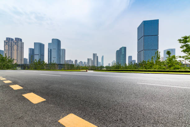 istock Panoramic skyline and modern business office buildings with empty road,empty concrete square floor 972377180