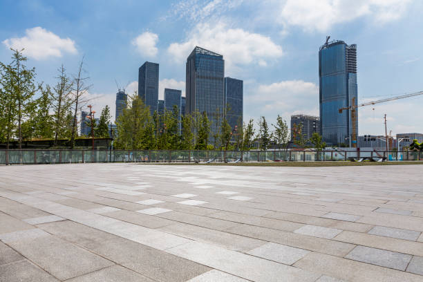 istock Panoramic skyline and modern business office buildings with empty road,empty concrete square floor 972377230
