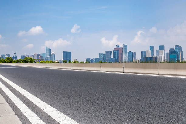 istock Panoramic skyline and modern business office buildings with empty road,empty concrete square floor 972377232