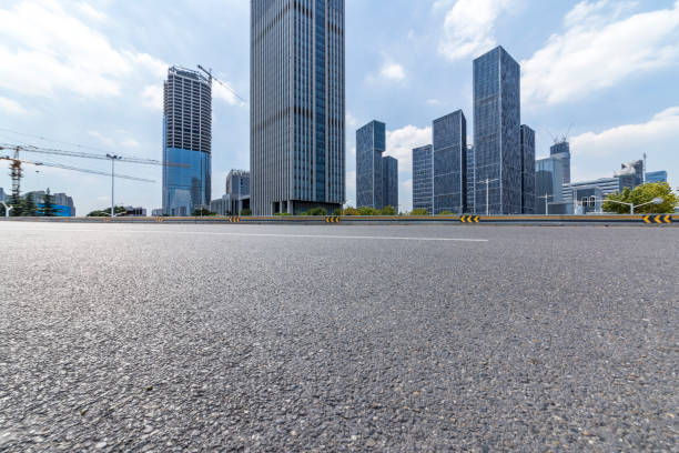 istock Panoramic skyline and modern business office buildings with empty road,empty concrete square floor 972379462