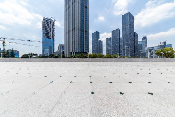 istock Panoramic skyline and modern business office buildings with empty road,empty concrete square floor 972379518
