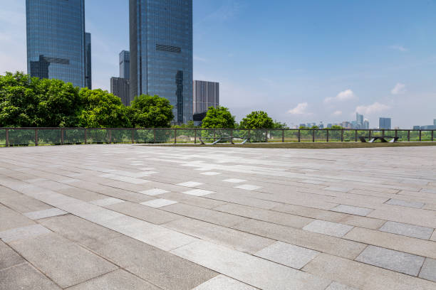 istock Panoramic skyline and modern business office buildings with empty road,empty concrete square floor 972379560