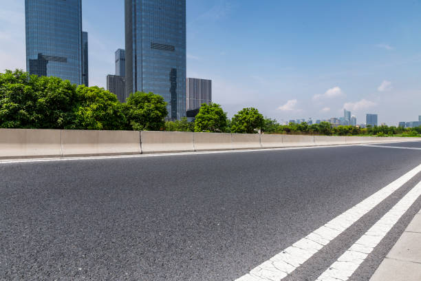 istock Panoramic skyline and modern business office buildings with empty road,empty concrete square floor 972379578
