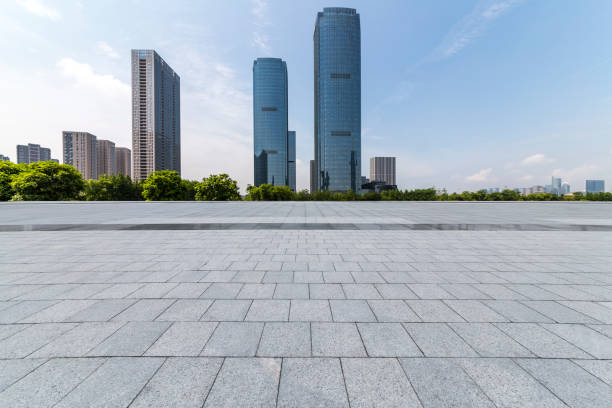 istock Panoramic skyline and modern business office buildings with empty road,empty concrete square floor 972381834
