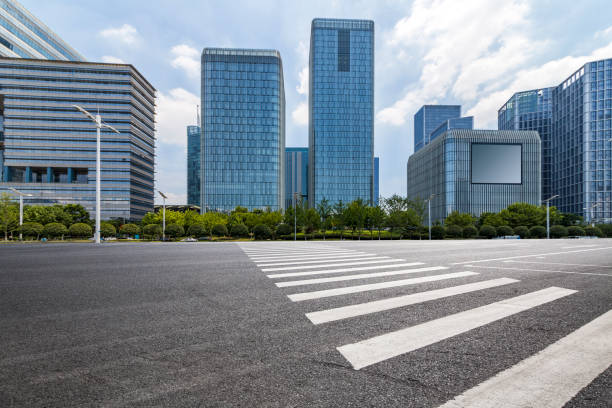 istock Panoramic skyline and modern business office buildings with empty road,empty concrete square floor 972382030