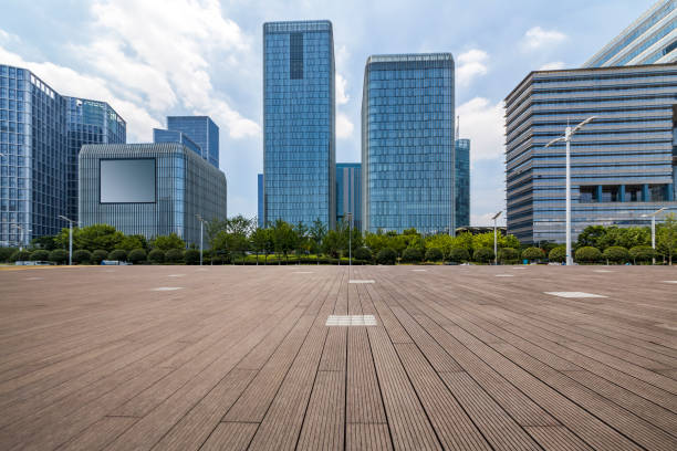 istock Panoramic skyline and modern business office buildings with empty road,empty concrete square floor 972382060