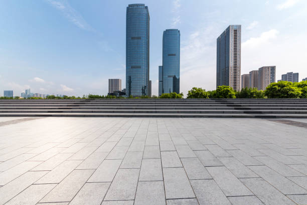 istock Panoramic skyline and modern business office buildings with empty road,empty concrete square floor 972384100