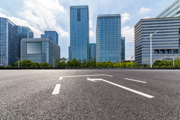 istock Panoramic skyline and modern business office buildings with empty road,empty concrete square floor 972384164
