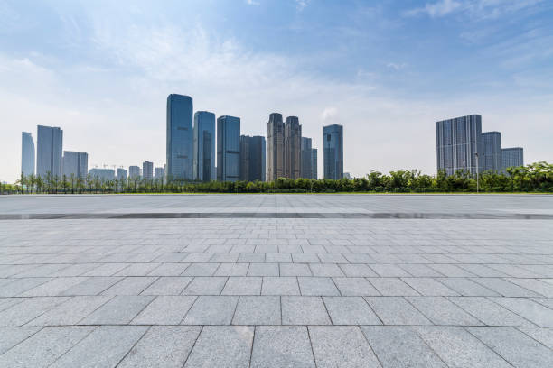 istock Panoramic skyline and modern business office buildings with empty road,empty concrete square floor 972384214