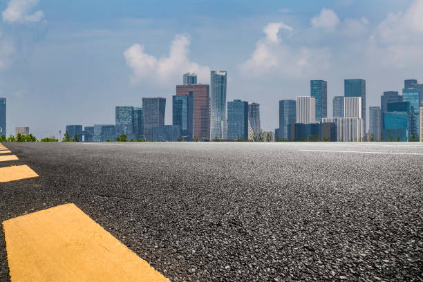 istock Panoramic skyline and modern business office buildings with empty road,empty concrete square floor 972384374