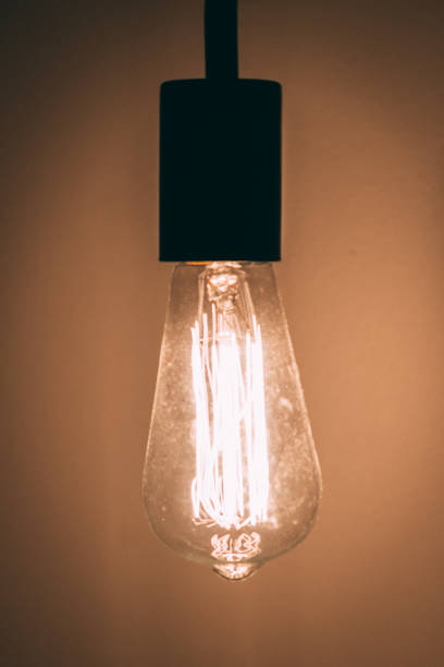 istock Industrial light bulb incandescent on and bright 972386692
