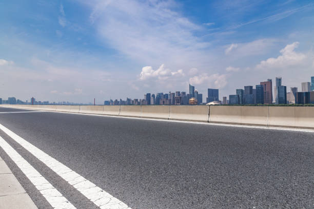 istock Panoramic skyline and modern business office buildings with empty road,empty concrete square floor 972388796