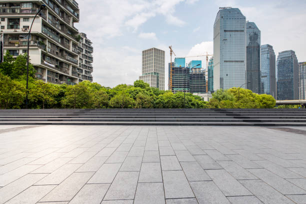 istock Panoramic skyline and modern business office buildings with empty road,empty concrete square floor 972388850