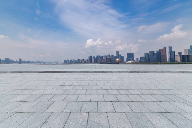 istock Panoramic skyline and modern business office buildings with empty road,empty concrete square floor 972388860
