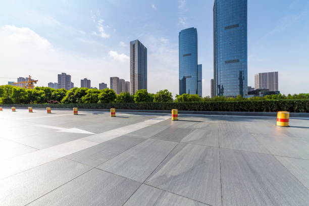istock Panoramic skyline and modern business office buildings with empty road,empty concrete square floor 972388930