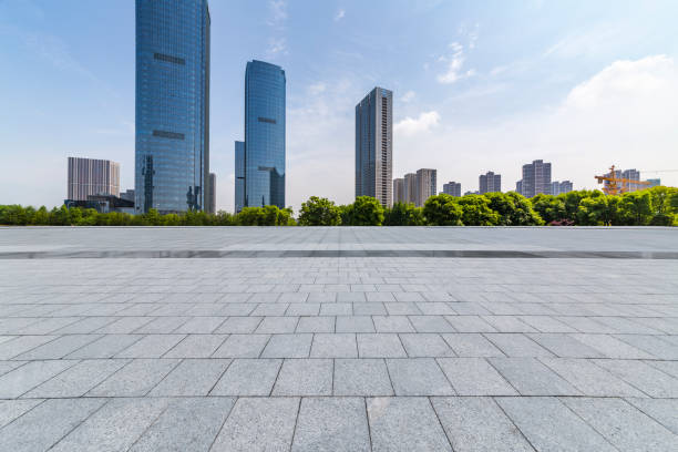 istock Panoramic skyline and modern business office buildings with empty road,empty concrete square floor 972389028