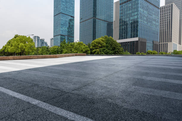 istock Panoramic skyline and modern business office buildings with empty road,empty concrete square floor 972389064