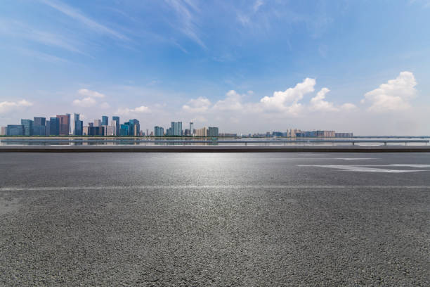 istock Panoramic skyline and modern business office buildings with empty road,empty concrete square floor 972391108