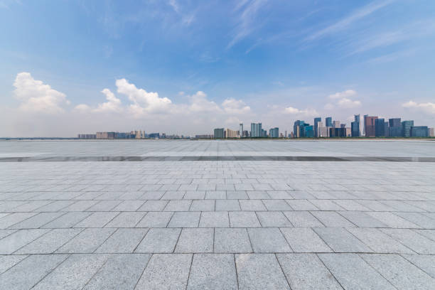 istock Panoramic skyline and modern business office buildings with empty road,empty concrete square floor 972391170