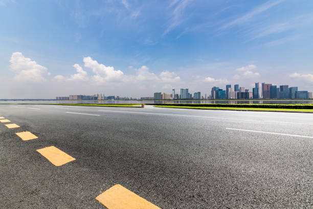 istock Panoramic skyline and modern business office buildings with empty road,empty concrete square floor 972391238