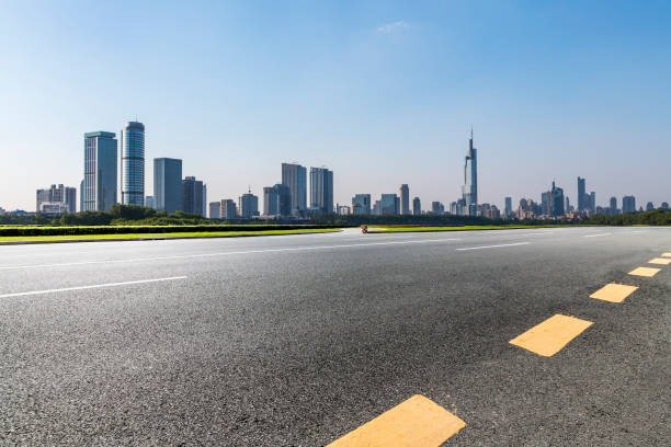 istock Panoramic skyline and modern business office buildings with empty road,empty concrete square floor 972391312