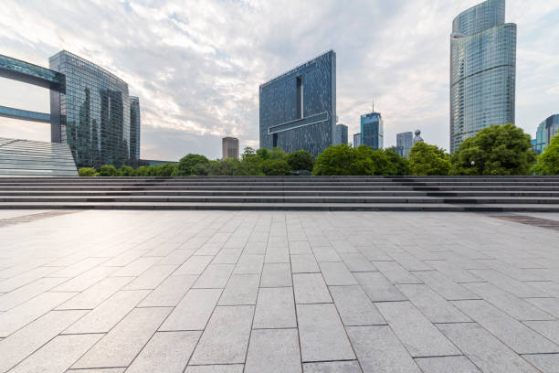 istock Panoramic skyline and modern business office buildings with empty road,empty concrete square floor 972391338