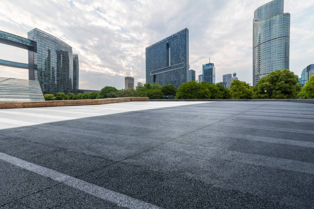 istock Panoramic skyline and modern business office buildings with empty road,empty concrete square floor 972391452