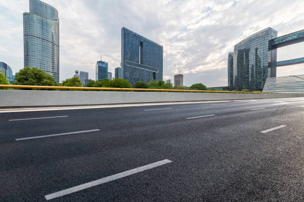 istock Panoramic skyline and modern business office buildings with empty road,empty concrete square floor 972391466